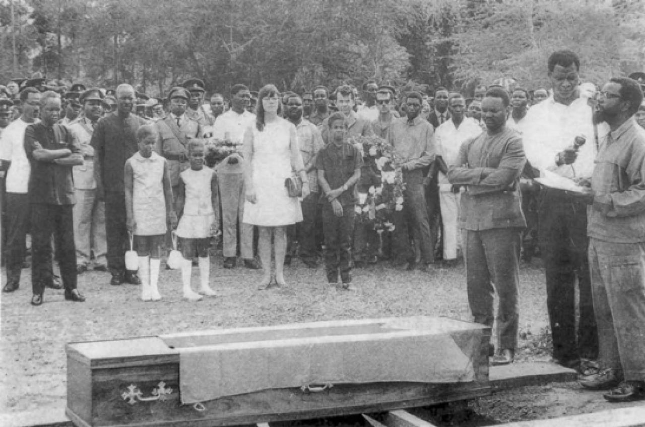 Mourners at a graveside.