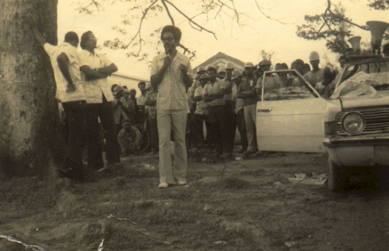 Man addressing crowd.