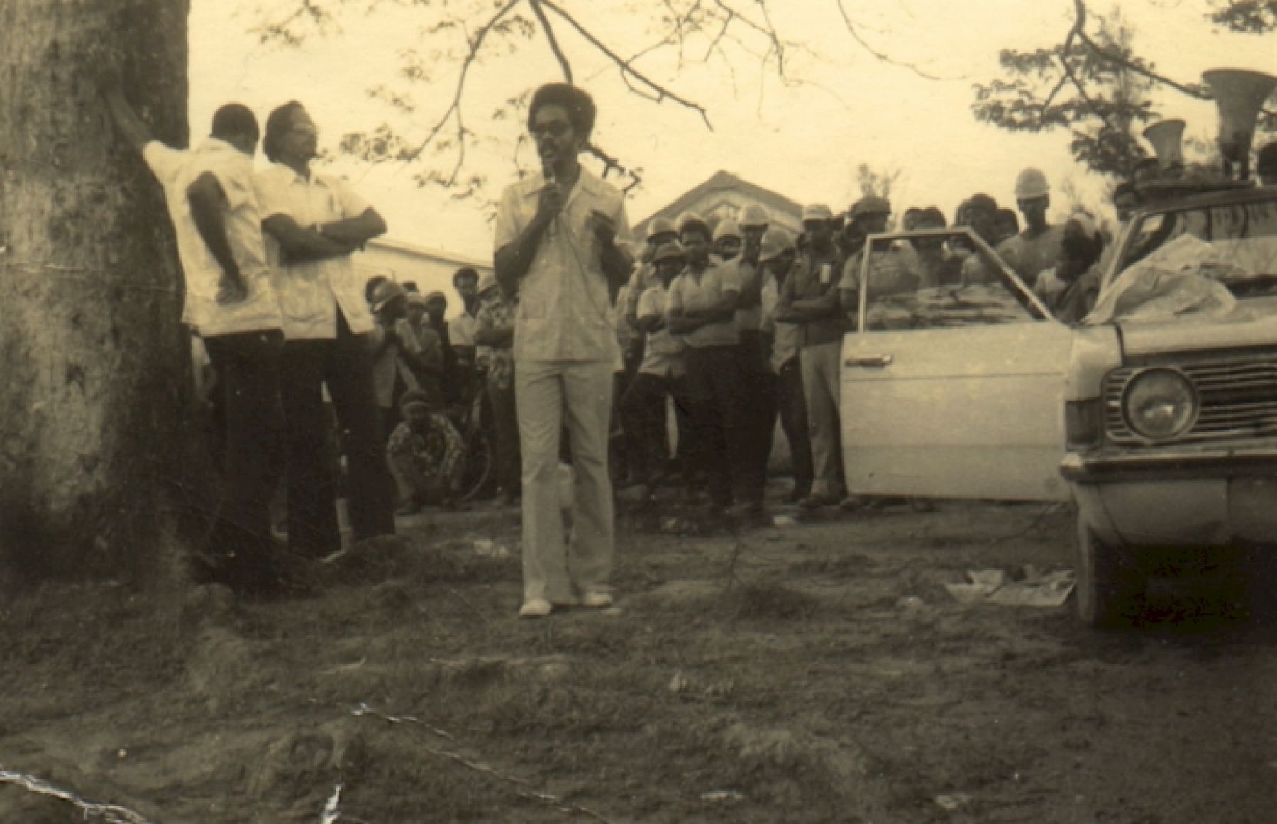 Man speaking in front of audience.